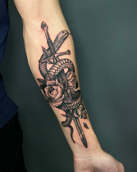 snake with sword tattoo meaning.